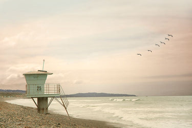 Lifeguard station at dawn decorative canvas art print by Addison Rhonda, featuring a serene beach scene with a lifeguard station.