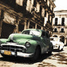 Cuban Cars II photography canvas art print by Feeling at Home featuring vintage Cuban cars on a scenic street scene.