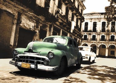 Cuban Cars II photography canvas art print by Feeling at Home featuring vintage Cuban cars on a scenic street scene.