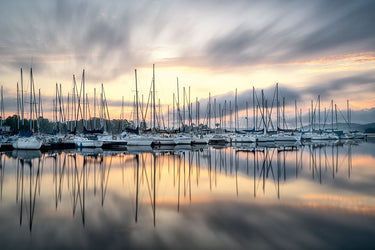 Feeling at Home Sailors Sunrise canvas art print by Burt D. showcasing a vibrant sunrise scene with sailors on the water.