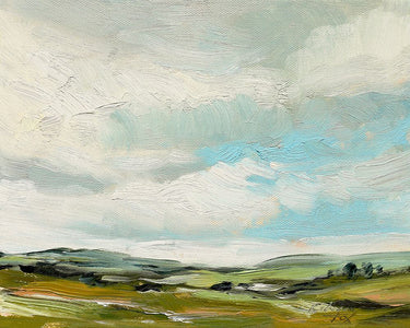Countryside landscape canvas art print by Feeling at Home featuring a peaceful rural scene with rolling hills and greenery.