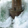 Coastal canvas art print titled "Phares dans la Tempete La Jument" by Guichard Jean, depicting a lighthouse scene in stormy weather.