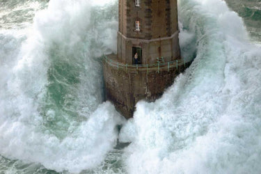 Coastal canvas art print titled "Phares dans la Tempete La Jument" by Guichard Jean, depicting a lighthouse scene in stormy weather.