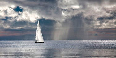 Coastal canvas art print of sailing on a silver sea by Feeling at Home, featuring a serene maritime scene in calming tones.