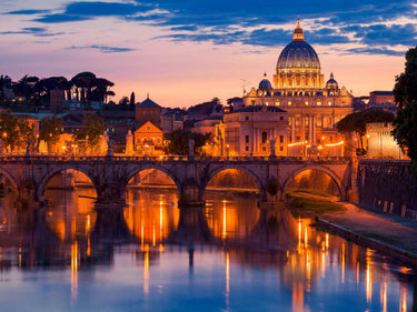 European canvas art print of St. Peters Cathedral at night by Feeling at Home, showcasing a detailed view of Rome's historic landmark.