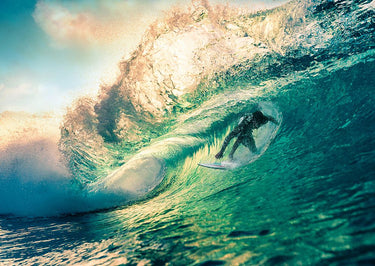 Coastal canvas art print of surfing at sunset in Australia by Feeling at Home, featuring vibrant ocean waves and sunset sky.