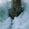Coastal canvas art print titled "Phares Dans La Tempête La Jument" by Guichard Jean, depicting a lighthouse in stormy seas.