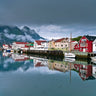Village in Lofoten Norway landscape canvas art print by Feeling at Home, showcasing colorful houses and scenic mountain views.