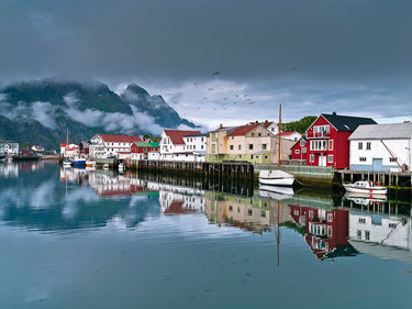 Village in Lofoten Norway landscape canvas art print by Feeling at Home, showcasing colorful houses and scenic mountain views.