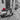 Canvas art print by Feeling at Home showing an old scooter with roses on a narrow Rome street, captured in a Frank Assaf photograph.