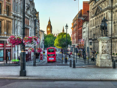 Colorful streets of London city with a red double-decker bus, featuring iconic UK scenery in a framed art print by Feeling at Home.