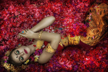 Balinese woman among colorful flowers, Feeling at Home art print by Gabriel Barathieu, showcasing vibrant floral and cultural imagery.