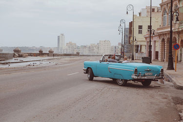 Havana Malecón photography canvas art print by Feeling at Home, featuring vibrant seaside cityscape with waves and historic architecture.