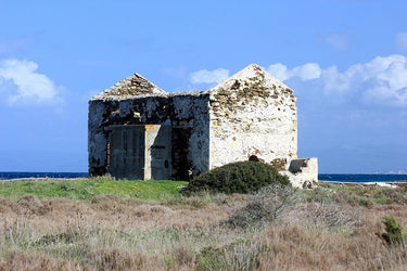 Silent ruined ancient house front sea landscape canvas art print by Giordano V., featuring a weathered house overlooking the ocean.