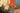 Abstract canvas art print by Guedez Carmen, featuring vibrant, textured brushstrokes in warm and cool tones on a wall display.