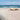 Feeling at Home Low Tide Coastal canvas art print featuring a serene beach scene with gentle waves and soft pastel colors.