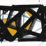 Black and gold abstract canvas art print by Feeling at Home, featuring modern geometric design with bold gold accents.