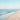 Sunlit shoreline decorative canvas art print by Lazar Studio, featuring a serene beach scene for a calming home decor accent.