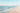 Sunlit shoreline decorative canvas art print by Lazar Studio, featuring a peaceful coastal scene with waves and sandy beach.