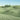 Green Italian countryside landscape canvas art print by Feeling at Home featuring rolling hills and vibrant greenery.