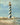 Coastal lighthouse canvas art print by Nai Danhui, featuring a serene seaside scene, perfect for coastal home decor.