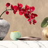 Red orchids on white marble floral canvas art print by Feeling at Home, featuring vibrant red flowers on elegant marble background.