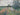 Feeling at Home Monet Claude Promenade pres d’Argenteuil landscape canvas art print showing a serene riverside scene with trees and sky.