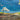 Landscape canvas art print by Larotonda Donato featuring a large moon gazing over a scenic landscape, branded Feeling at Home.