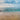 Coastal canvas art print of sandy beach scene by Frank Assaf, featuring calming ocean waves and shoreline, by Feeling at Home.